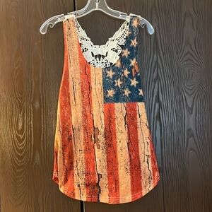 Yu Ki sleeveless patriotic top with beautiful lace back. Size Medium.